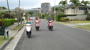 Riding mopeds through Hawaii Kai